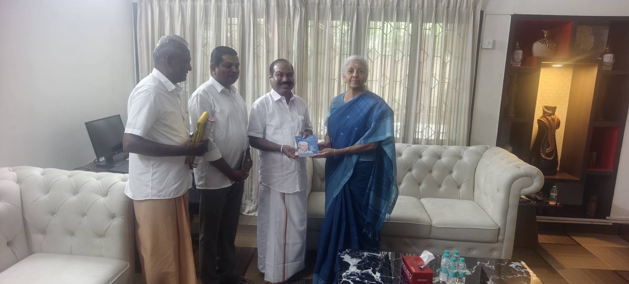 Presenting a memento to Union Finance Minister Nirmala Sitharaman during a visit to Delhi — part of Kalidass's outreach connecting T. Nagar concerns to national leadership.